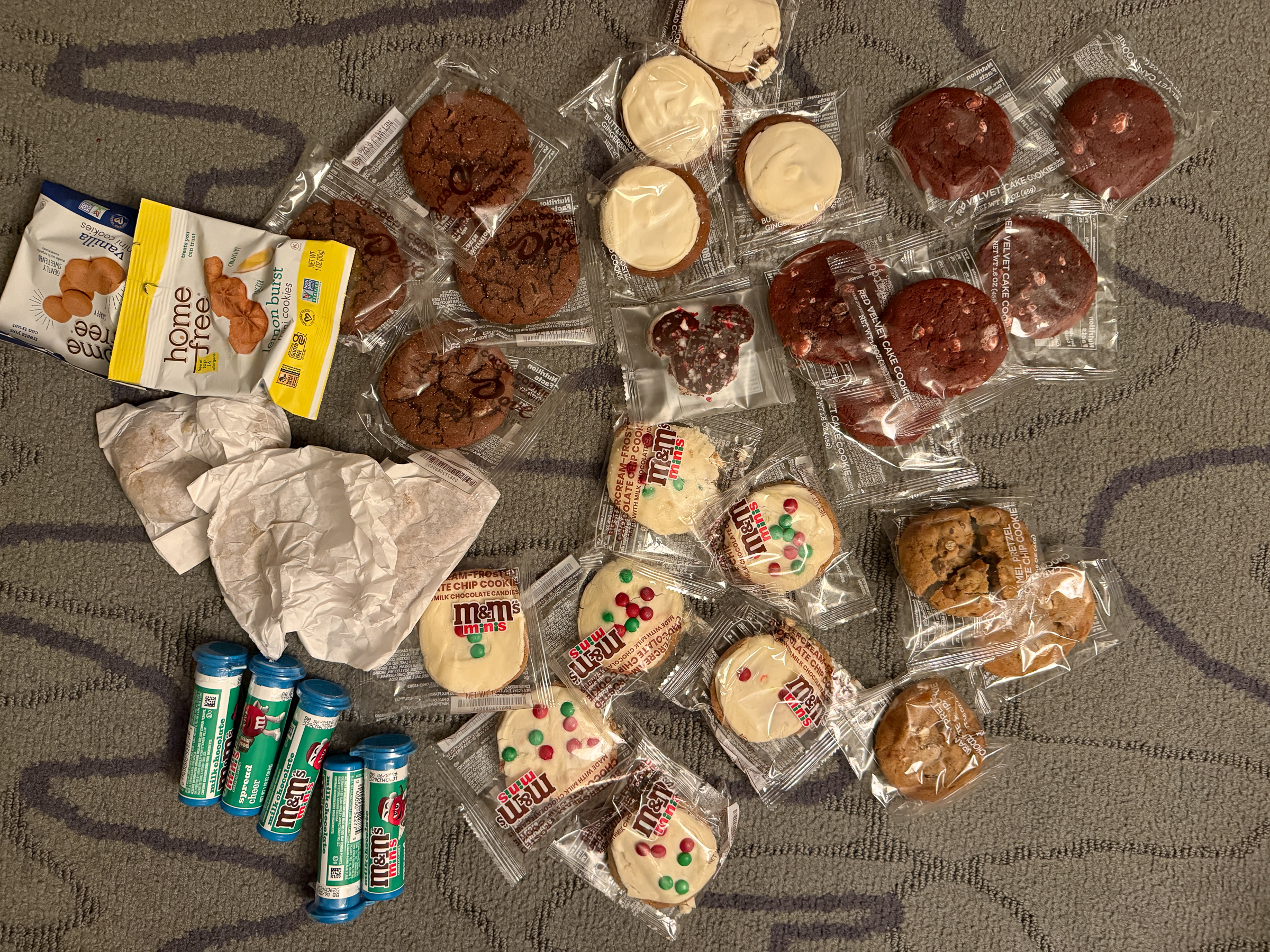 Assortment of wrapped cookies and Christmas treats collected at Mickey’s Very Merry Christmas Party.